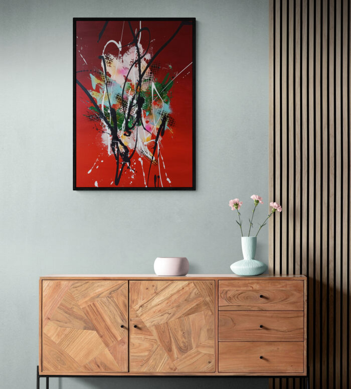 colorful flowers in vase sitting on cabinet