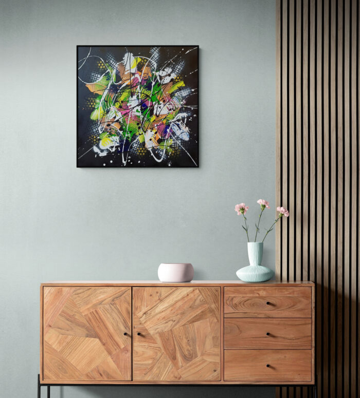 colorful flowers in vase sitting on cabinet